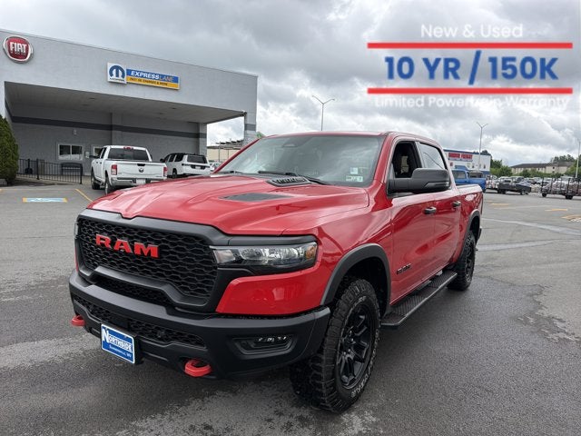 2025 RAM 1500 Rebel in Flame Red Clearcoat — front three-quarter view