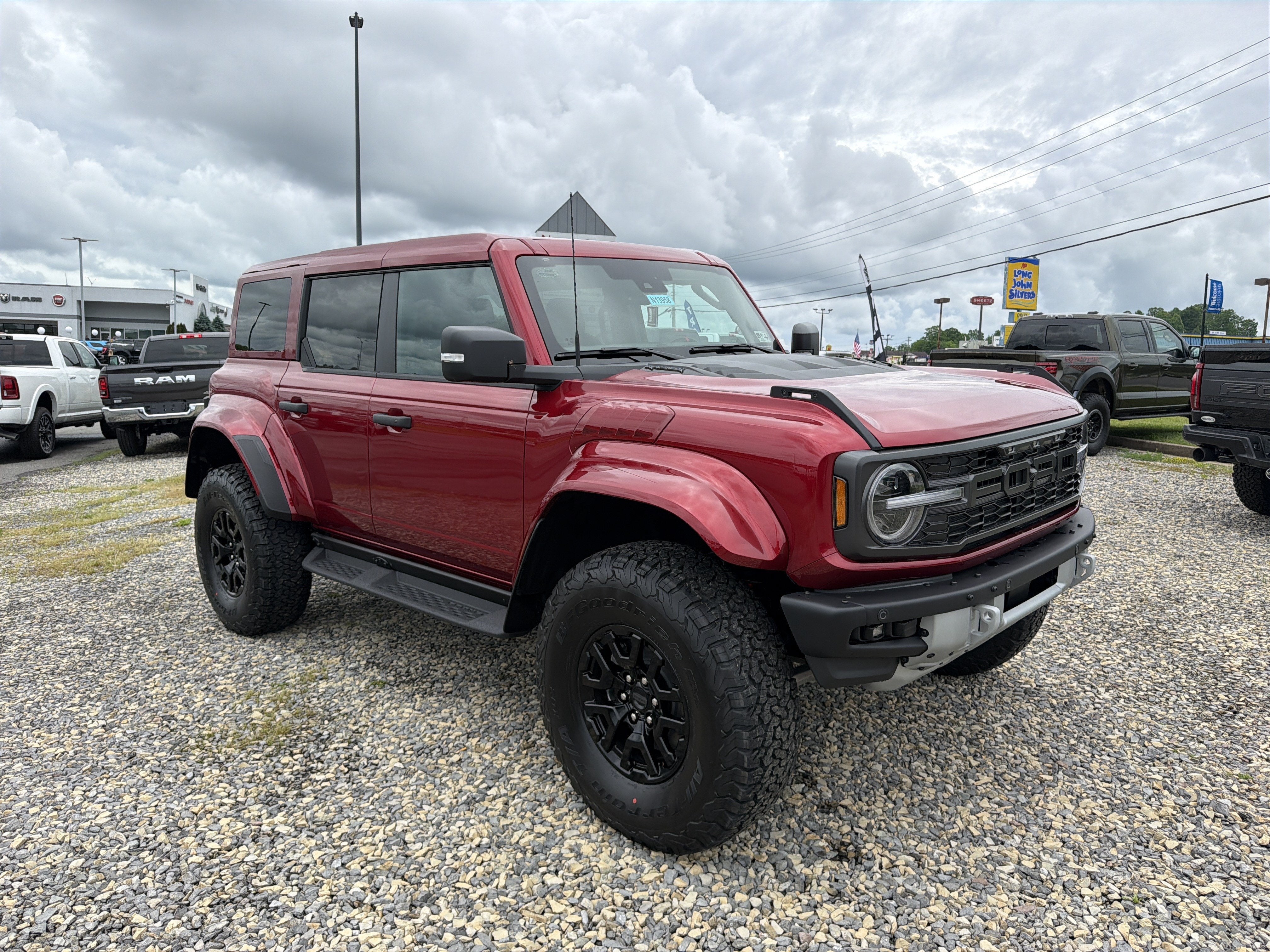 2026 Ford Bronco Raptor in Ruby Red Metallic Tinted Clearcoat — front three-quarter view
