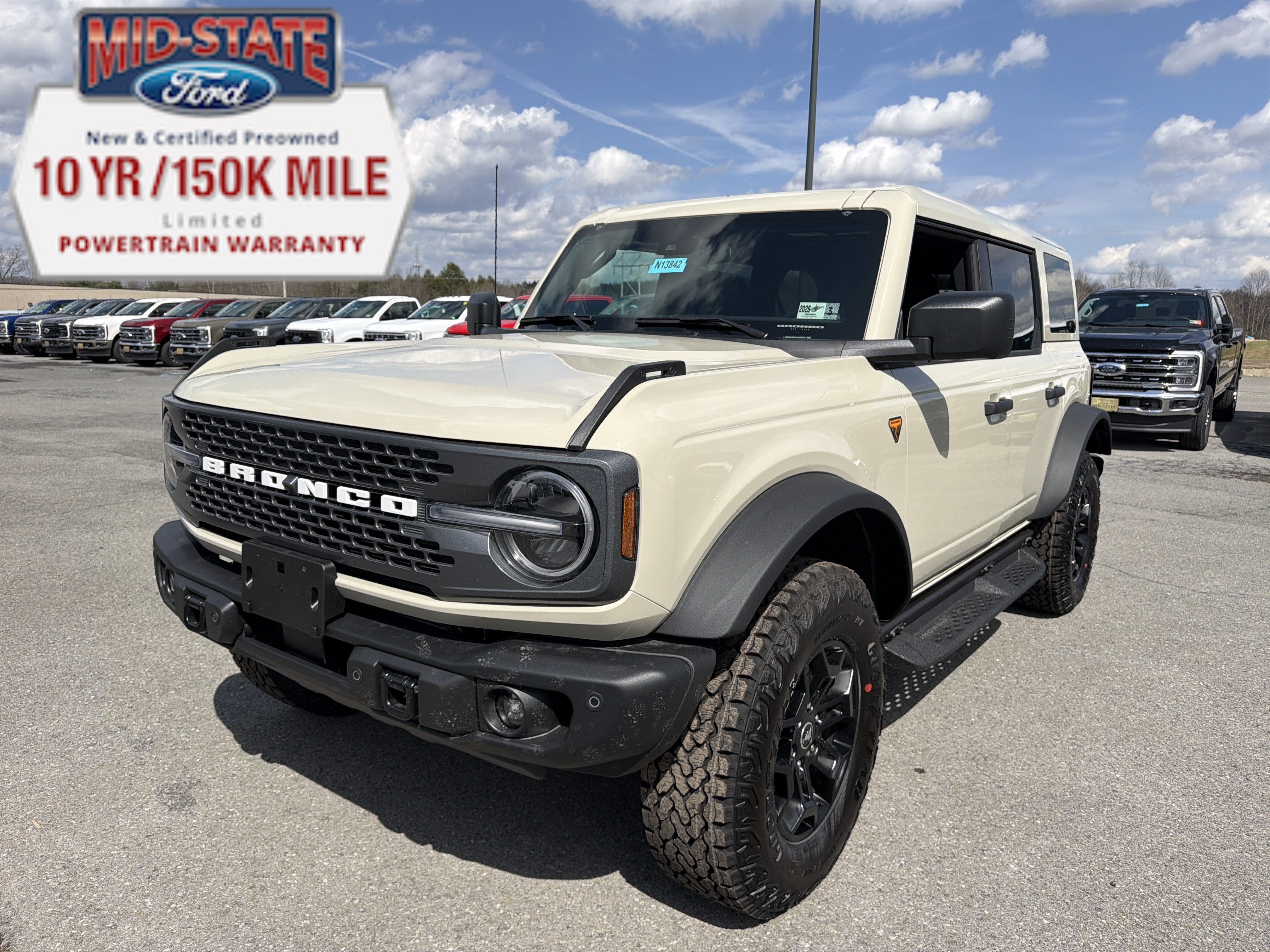 2026 Ford Bronco Badlands in Desert Sand — front three-quarter view